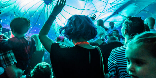 mom dancing under parachute